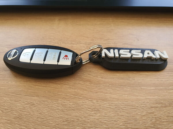Llavero Nissan Personalizado Numero Telefono O Patente 3d - Imagen 2